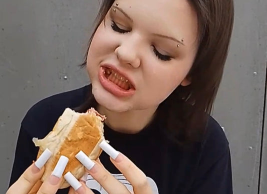 neon green tooth gems. girl eating hamburger testing tooth gems.